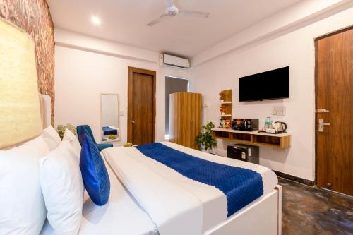 TV a/nebo společenská místnost v ubytování Hotel Noida Business Suites