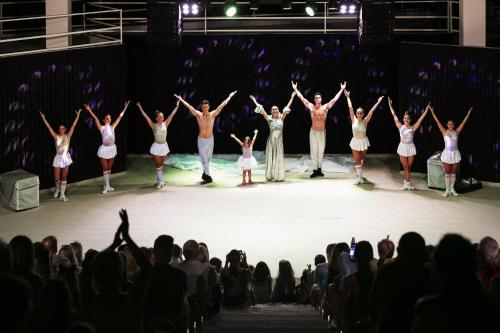 a group of people on a stage with their arms in the air at Duja Bodrum in Torba