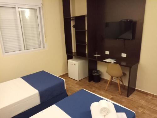 Postel nebo postele na pokoji v ubytování Hotel Rexton