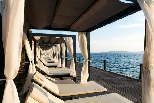 a row of chairs on the deck of a boat at Duja Bodrum in Torba