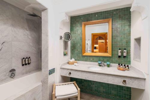 a bathroom with a sink and a mirror at Jaal Riad Resort in Marrakech