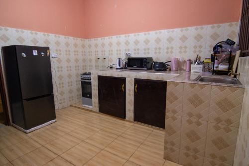 Virtuve vai virtuves zona naktsmītnē Simba homes