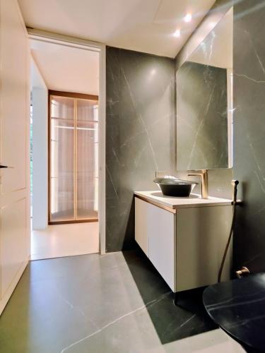 a kitchen with a counter and a sink at Villa Takiana - 4BHK pvt pool, Gym, 5mins to beach in Anjuna