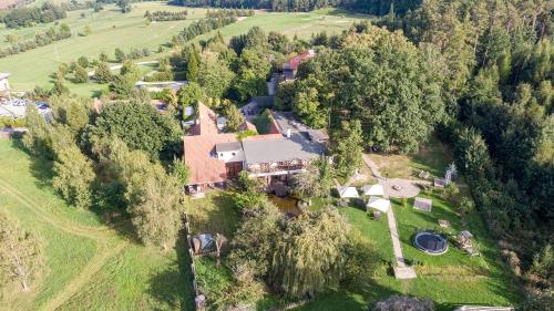 an aerial view of a large house in a field at Areal Botanika in Unhošť