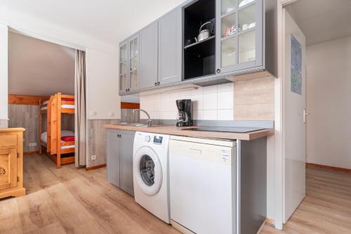 a kitchen with a washer and dryer at Balcons G 045 - PARC NAT VANOISE appart 8 pers in Val Cenis