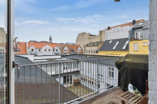 a view of a city from a balcony at City center apartment with balcony and private parking in Aalborg