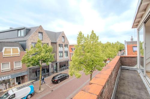 a view of a street from an apartment building at Stay de Laat in Alkmaar
