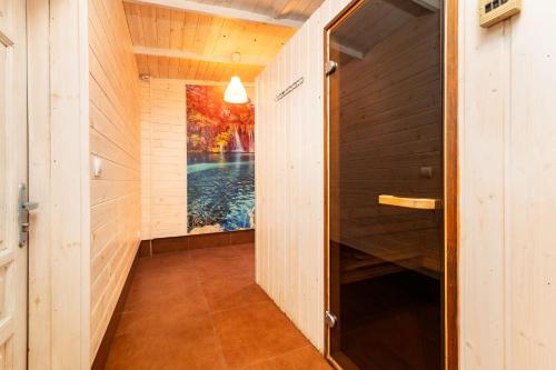 a hallway of a house with a swimming pool at Letnisko BAJKA in Iława