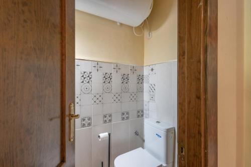 a bathroom with a toilet and a sink at Can Vall Bellver in Bellver de Cerdanya 