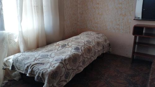 a bed in a corner of a room at Welcome to Ashtarak in Ashtarak