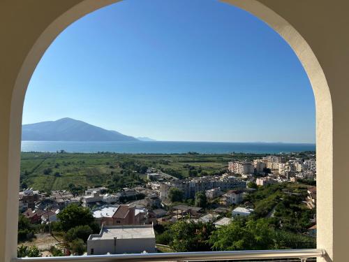 a view of a city from a window at Kings Castle Sea View Apartments in Orikum