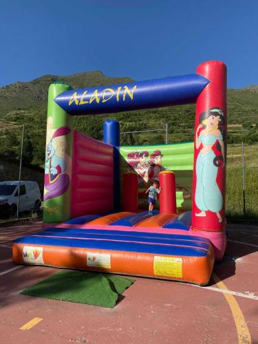 a inflatable play set in a parking lot at Hotel Romànic in Pla de l'Ermita