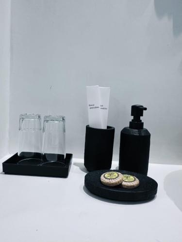 a table with a blender and two glasses and cookies at Arlene Suites in Mesaria