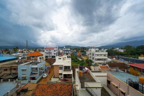 a view of a city with buildings at Olive Hotel Chikkamagalur by Embassy Group in Jāmb