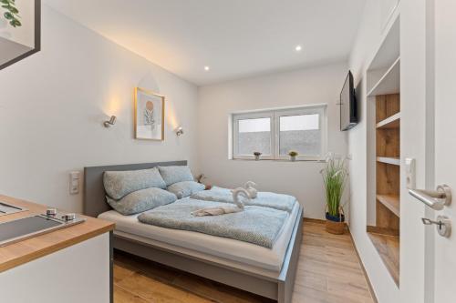 a small living room with a couch and a window at Family and Friends Dannstadt in Dannstadt-Schauernheim