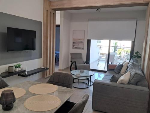 a living room with a couch and a table at Lama's Residence in Nicosia