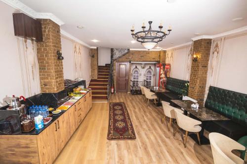 a restaurant with tables and chairs in a room at Kupa HOTEL in Istanbul