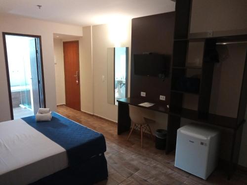 Postel nebo postele na pokoji v ubytování Hotel Rexton