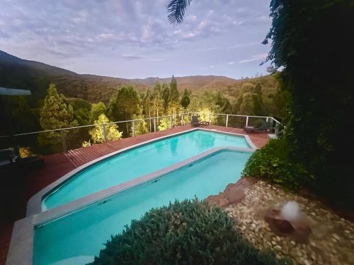 a swimming pool with a view of the mountains at RIVERLEA RETREAT MUDGEE - Private, Outdoor Bath, Pool, Tranquility in Apple Tree Flat