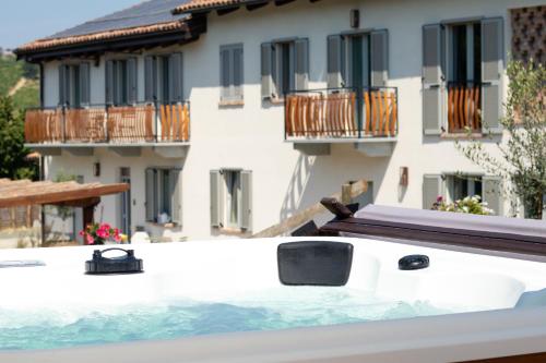 a hot tub on the balcony of a building at Cà d'Rita Monferrato - Barbera in Vinchio