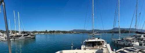 a group of boats docked in a harbor at Stunning Motor Yacht in Corfu in Gouvia