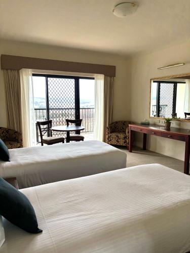 Ένα ή περισσότερα κρεβάτια σε δωμάτιο στο Turners Vineyard Motel