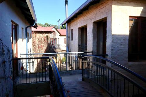 a stairway leading to a balcony of a building at Cherry Nest in Dullstroom