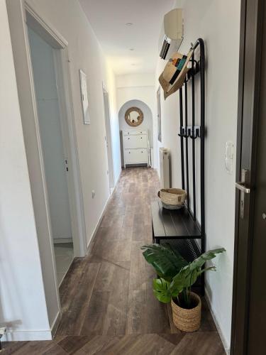 a hallway with white walls and wooden flooring in a home at Welcoming 3 Bedroom Home in Perdika, Thesprotias in Perdika