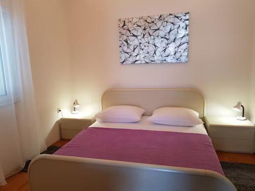 Ένα ή περισσότερα κρεβάτια σε δωμάτιο στο Apartment MiM