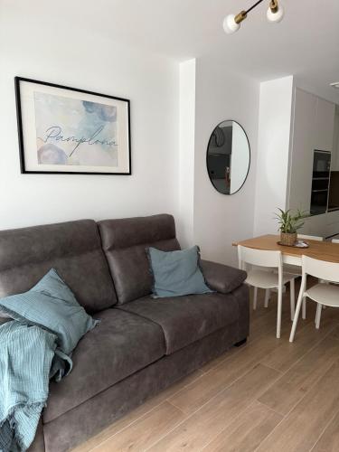 a living room with a couch and a table at Soto Deluxe by Clabao in Pamplona