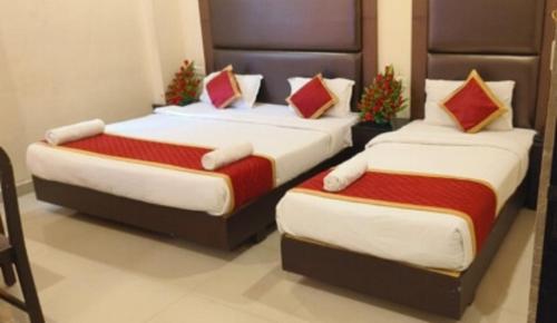 Un ou plusieurs lits dans un hébergement de l'établissement Jet Fox by Aero View Hotel, Delhi Airport
