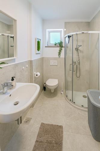 Ένα μπάνιο στο Olea apartments