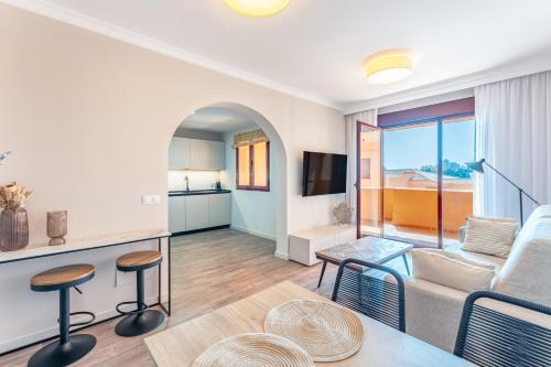 a living room with a couch and a table at Royal Marbella Golf Resort in Estepona
