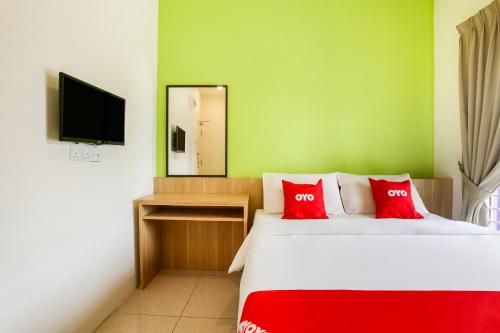 Кровать или кровати в номере Hotel O Seremban Near UiTM MARA Formerly Sunflower Hotel