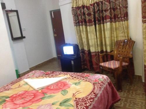 Una cama o camas en una habitación de Bishnu Homestay
