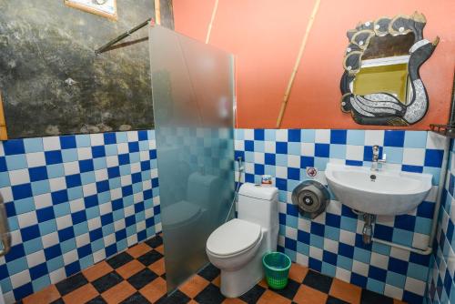 a bathroom with a toilet and a sink at Sairee View Resort in Koh Tao