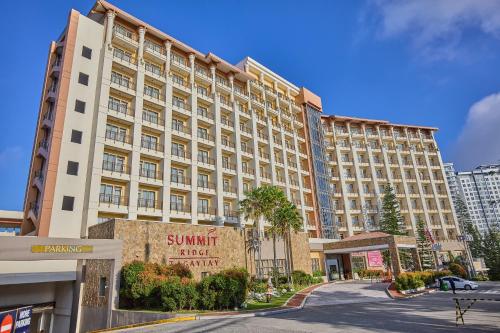 a large building with a sign in front of it at Summit Ridge Tagaytay - Newly Renovated in Tagaytay
