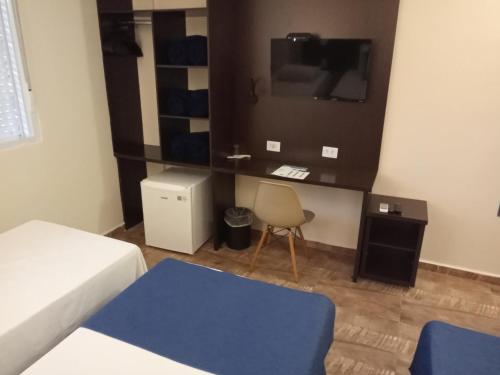 Postel nebo postele na pokoji v ubytování Hotel Rexton