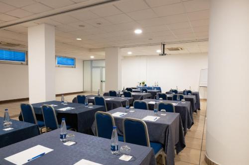 a conference room with tables and chairs in it at Hotel Dei Principati in Baronissi