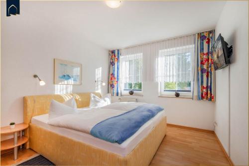 Ένα ή περισσότερα κρεβάτια σε δωμάτιο στο Apartment Seemöwe