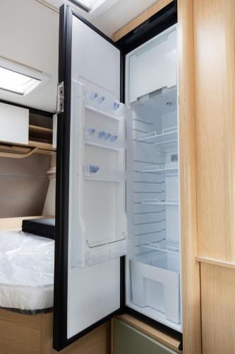 an empty refrigerator with its door open in a room at On Wheels by Yerra in Yervandashat