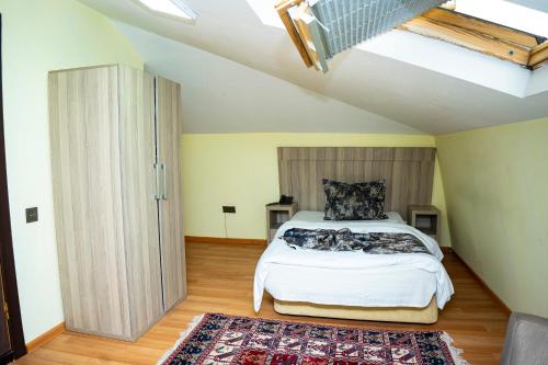 Postel nebo postele na pokoji v ubytování Nemi Boutique Hotel