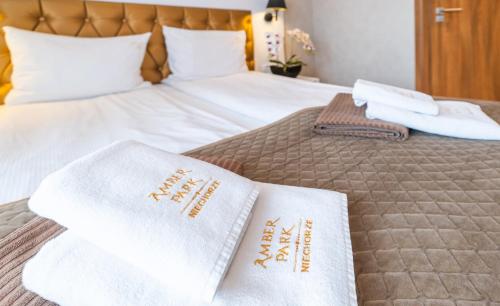 Postel nebo postele na pokoji v ubytování Promocje Amber Park Spa