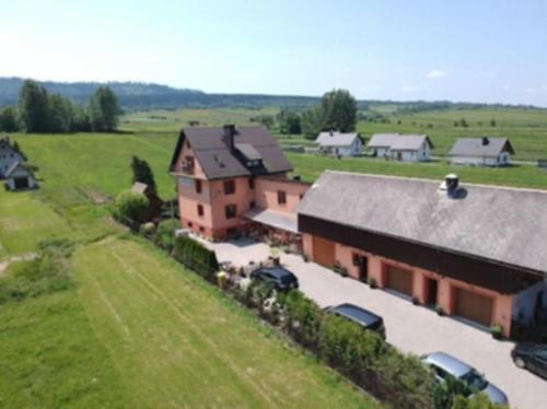 an aerial view of a house in a field at Apartamenty u Majki 2 in Frydman
