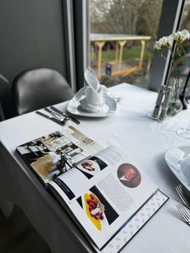 a table with a magazine on top of a table at Areal Botanika in Unhošť