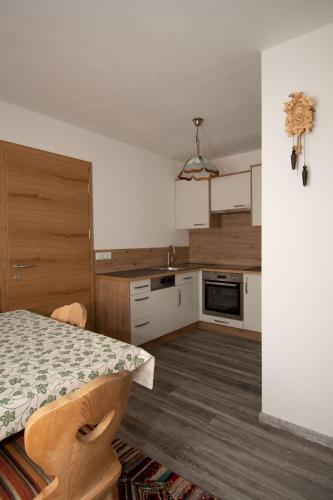a kitchen with a table and a counter top at Lexahaus in Liesing