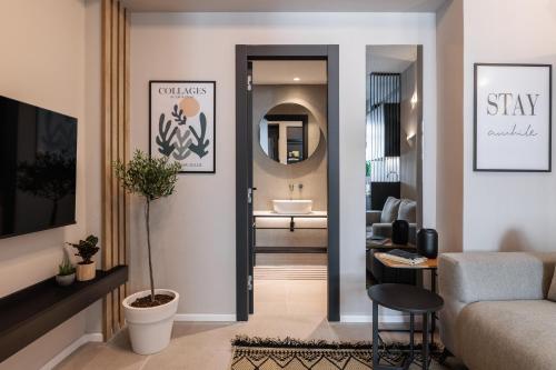 a living room with a hallway with a bathroom at TWO ENTIRE APARTMENTS LIV Luxury Central C-D in Thessaloniki