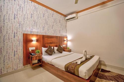 Ένα ή περισσότερα κρεβάτια σε δωμάτιο στο Hotel Mild Inn