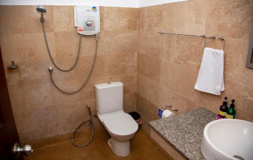 a bathroom with a shower and a toilet and a sink at Baan Talay in Salad Beach