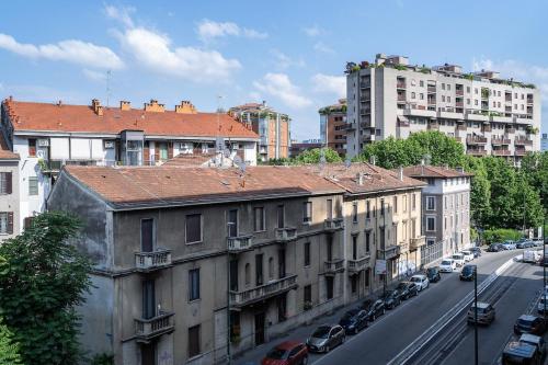 a view of a city street with buildings and cars at Free Wi-Fi Terrazza con vista metro 5 min in Sesto San Giovanni